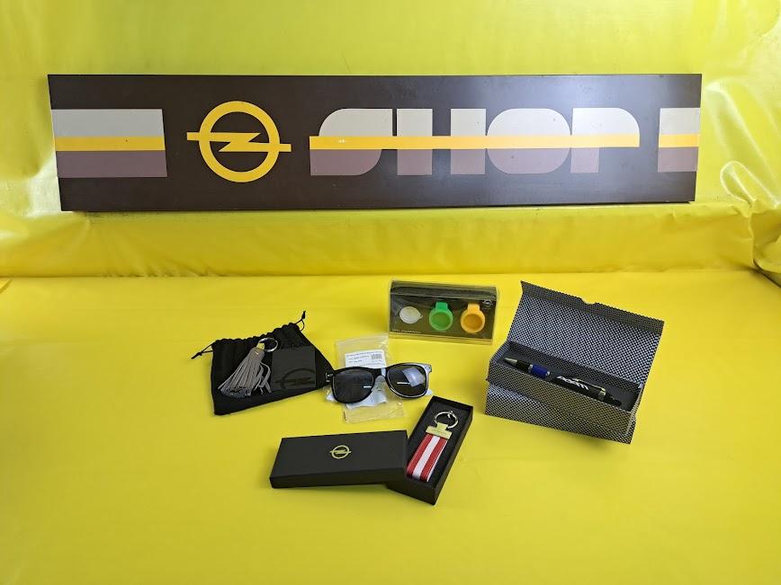 ID_82774_orig.jpg Konvolut Opel Adam Accessoires Set Geschenkset Sonnenbrille Kugelschreiber etc. Original Neu
